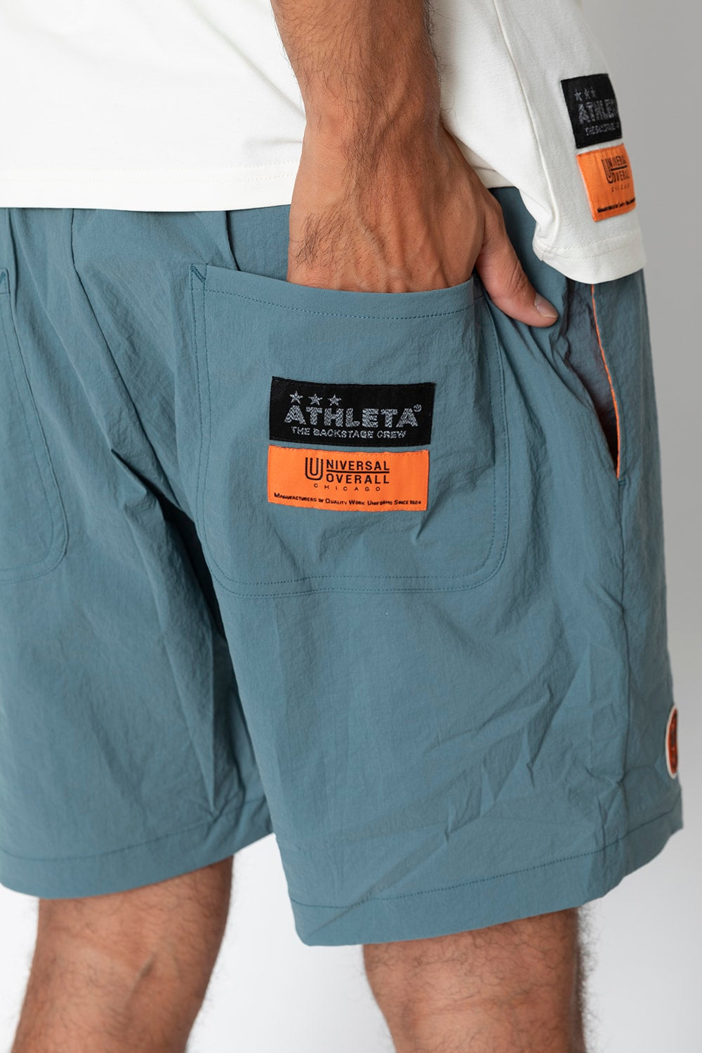 UNIVERSAL OVERALLxATHLETA – TBCパッカブルウインドショーツ